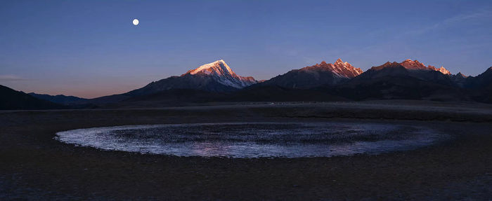 Scenic view of mountains against sky during sunset
