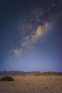 Scenic view of landscape against sky at night