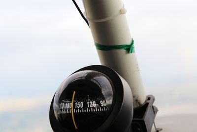 Close-up of sunglasses against sky