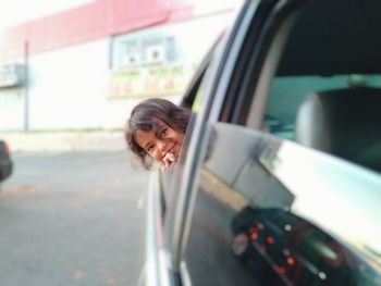 Portrait of smiling woman on road