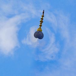 Low angle view of balloons against sky