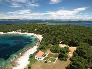 High angle view of swimming pool by sea against sky