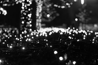 Defocused image of illuminated christmas lights at night