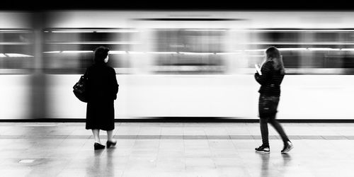 Full length of women at subway station