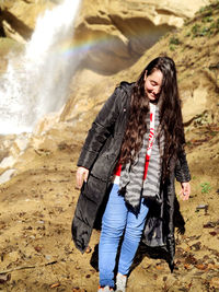 Portrait of beautiful woman on land