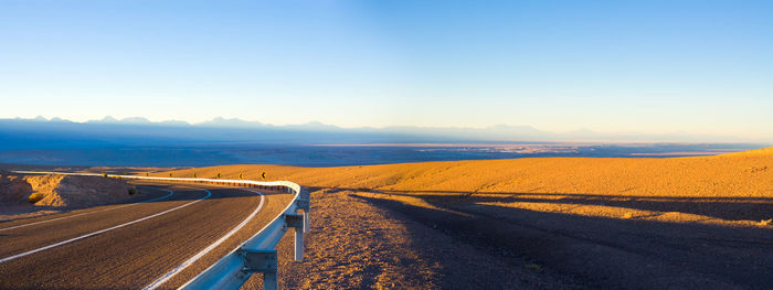 View of winding road against sky