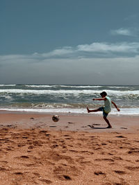 A boy is playing soccer 