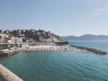 Beach in marseille with incredible clear water and mountains in the backround