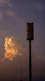 Low angle view of tower against sky during sunset