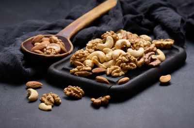 Walnut, almond, cashew on a wooden board. delicious nutritious snack