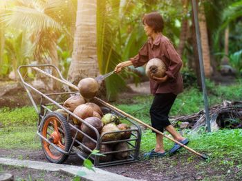 Full length of men with bicycle on plants