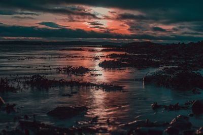 Scenic view of sea against sky at sunset