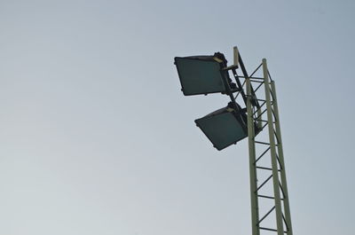 Low angle view of communications tower against clear sky