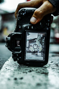 Close-up of person photographing