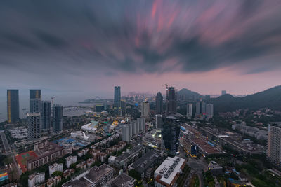 High angle view of buildings against sky during sunset