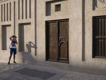 Woman standing in front of building