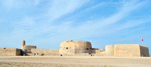 Old ruin building against blue sky