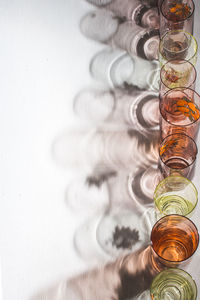 High angla of glasses with back light and beautiful shadows on the white background. copy space