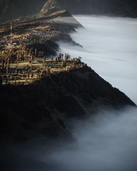 High angle view of sea and buildings against sky