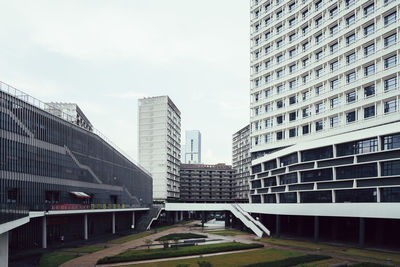 Modern buildings in city against sky