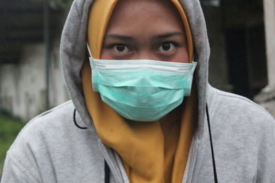 Close-up portrait of man covering face