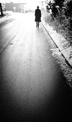 Full length of woman standing on railing
