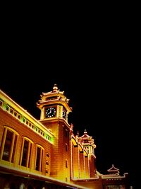 Low angle view of illuminated built structure