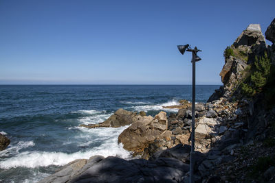 Scenic view of sea against clear blue sky