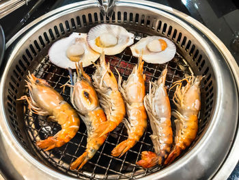 High angle view of meat on barbecue