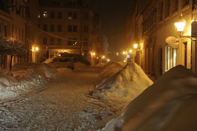 Snow covered city at night