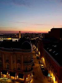 High angle view of illuminated buildings against sky during sunset