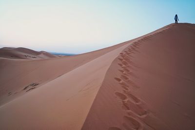 Scenic view of desert against clear sky