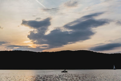 Scenic view of lake against sky during sunset