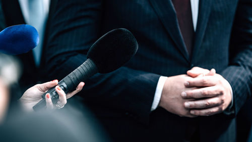 News reporters interviewing a politician.