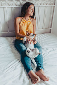 Young woman with dog at home