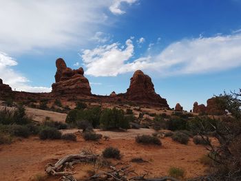 Rock formations on landscape against sky