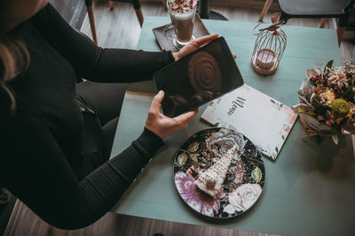 High angle view of people on table