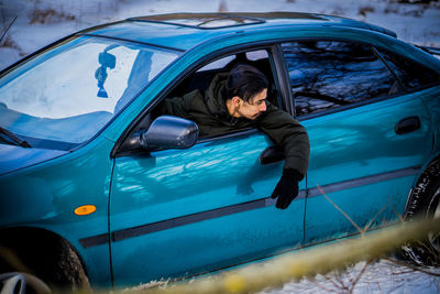 Low section of woman in car