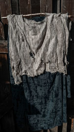 Close-up of clothes drying on wood