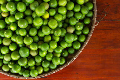 High angle view of fruits in basket on table