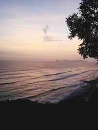 Scenic view of sea against cloudy sky