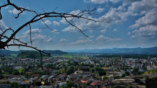 High angle view of cityscape against cloudy sky