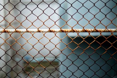 A steel fence which have rust to safety zone of the high voltage electric.