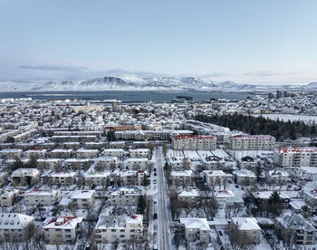 Buildings of snowy city from drone