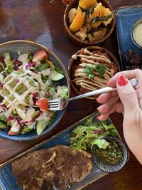 High angle view of person having food on table