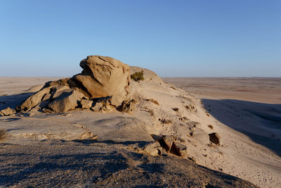 Scenic view of desert against clear sky