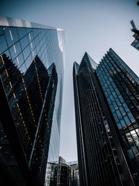 Low angle view of modern buildings against sky