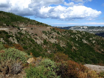 Scenic view of landscape and mountains against sky