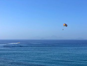 Parachute flying over blue sea