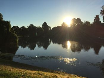 Scenic view of calm lake against sky